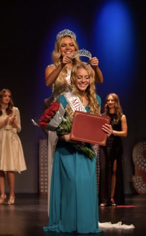 Dorman being crowned 2022 Miss Madison by the 2021 Miss Madison Maycee Kesler.