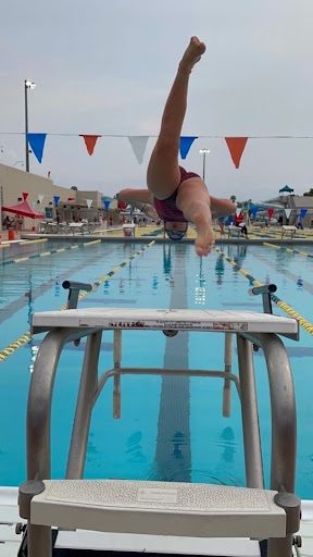 Waldron diving off the block at one of her meets. 
