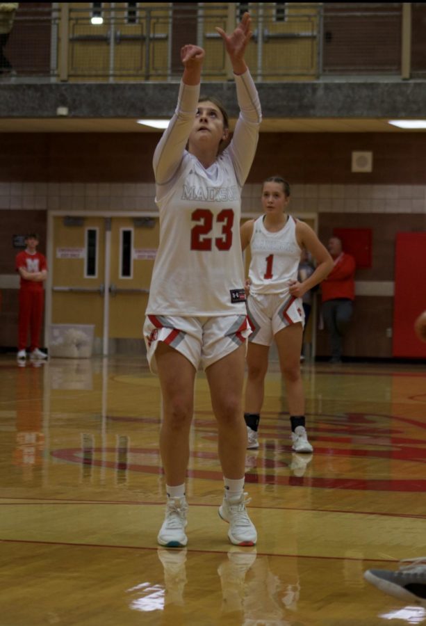 Kylie Kirk shoots a basket in the game against skyline.