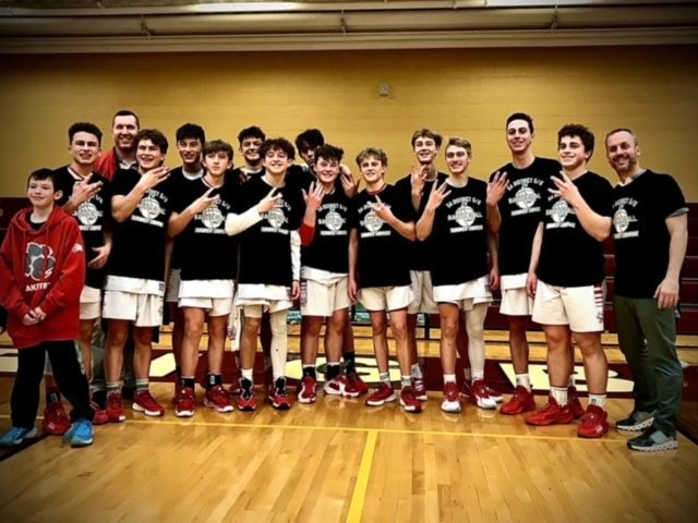 The JV cats with their new t shirts after beating Thunder Ridge 58-50