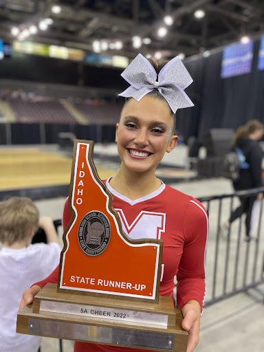 Johnson posing with the 2nd place plaque at state.
